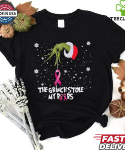 Official The Grinch Hand Holding Breast Cancer The Grinch Stole My Boobs Merry Christmas 2024 Gift Shirt featuring a humorous yet meaningful design combining the Grinch theme with a message of support for breast cancer awareness, making it a unique holiday gift.
