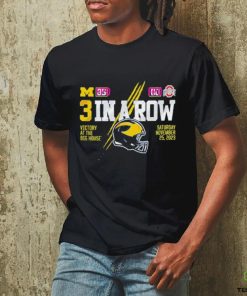 Official Valiant University of Michigan Football Navy ”3 In A Row” Ohio State Score Tee shirt 1 Official Valiant University of Michigan Football Navy ”3 In A Row” Ohio State Score Tee shirt