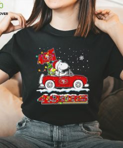 Happy Merry Christmas Snoopy drive a car San Francisco 49ers logo flag gift hoodie, sweater, longsleeve, shirt v-neck, t-shirt