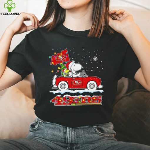 Happy Merry Christmas Snoopy drive a car San Francisco 49ers logo flag gift hoodie, sweater, longsleeve, shirt v-neck, t-shirt