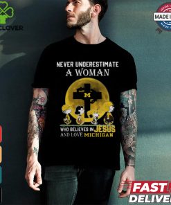 Peanuts Characters Never Underestimate A Woman Who Believes In Jesus And Loves Michigan Wolverines Shirt