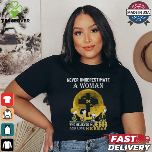 Peanuts Characters Never Underestimate A Woman Who Believes In Jesus And Loves Michigan Wolverines Shirt