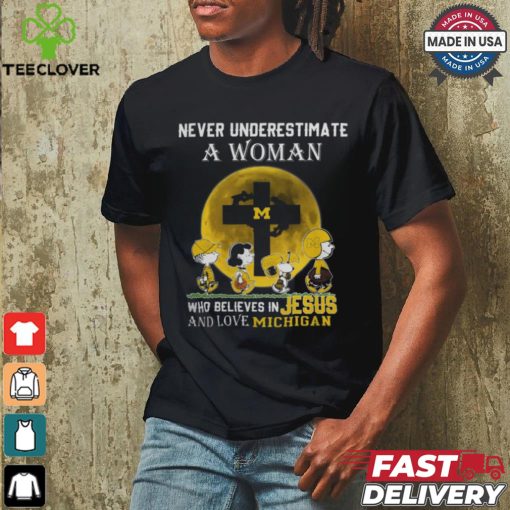 Peanuts Characters Never Underestimate A Woman Who Believes In Jesus And Loves Michigan Wolverines Shirt