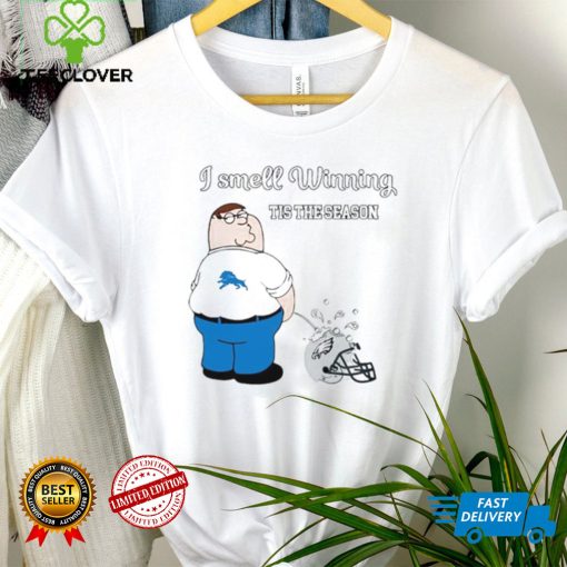 Peter Griffin Detroit Lions peeing on Philadelphia Eagles helmet I smell winning tis the season hoodie, sweater, longsleeve, shirt v-neck, t-shirt