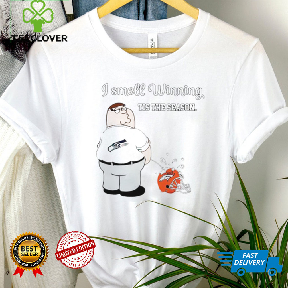 Peter Griffin Seattle Seahawks I smell winning tis the season peeing on Denver Broncos helmet shirt Peter Griffin Seattle Seahawks I smell winning tis the season peeing on Denver Broncos helmet shirt