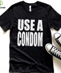 Rihanna’s USE A Condom Shirt