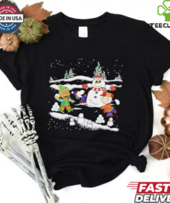 Snoopy Christmas Snowman Shirt featuring a cheerful design of Snoopy and Woodstock building or posing with a snowman, capturing the festive spirit of the holiday season.