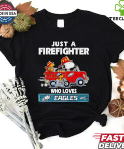 Snoopy and Woodstock Just a Firefighter Who Loves Philadelphia Eagles Shirt featuring a fun design that combines the beloved characters with a firefighter's pride and Eagles fandom. Show your love for both the Eagles and your profession with this unique, spirited apparel.