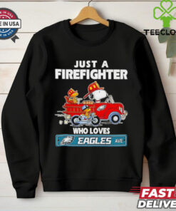 Snoopy and Woodstock Just a Firefighter Who Loves Philadelphia Eagles Shirt featuring a fun design that combines the beloved characters with a firefighter's pride and Eagles fandom. Show your love for both the Eagles and your profession with this unique, spirited apparel.