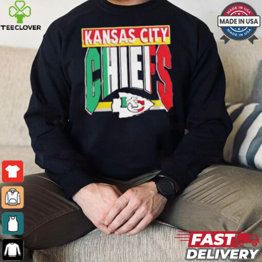 Taylor wearing Kansas City Chiefs Mexican style shirt