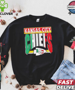 Taylor wearing Kansas City Chiefs Mexican style shirt