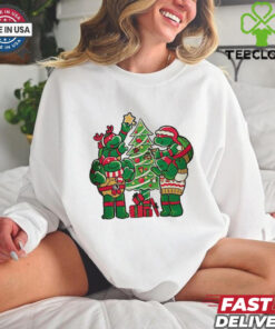 Teenage Mutant Ninja Turtles decorating their Christmas tree shirt