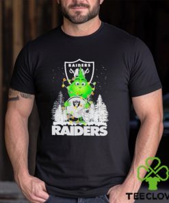 The Baby Grinch hugging Las Vegas Raiders helmet snowy forest Christmas hoodie, sweater, longsleeve, shirt v-neck, t-shirt