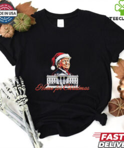 Trump Santa Home For Christmas T-shirts featuring a festive design with Donald Trump dressed as Santa, spreading holiday cheer and celebrating the season.