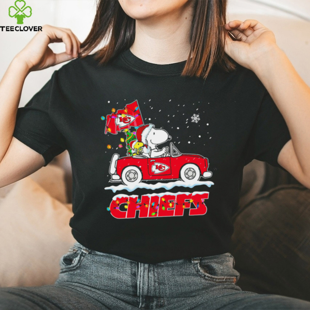 Happy Merry Christmas Snoopy drive a car Kansas City Chiefs logo flag gift shirt Happy Merry Christmas Snoopy drive a car Kansas City Chiefs logo flag gift shirt
