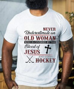 Never underestimate an old woman who is covered by the blood of jesus and loves hockey shirt