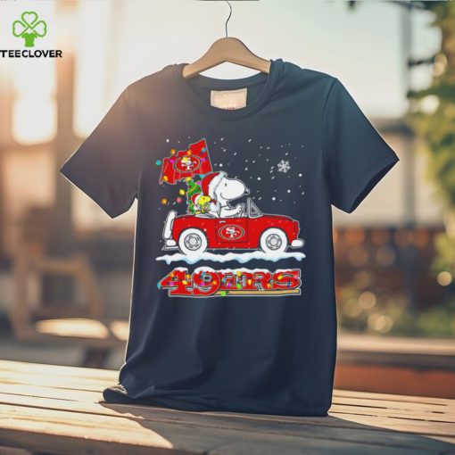 Happy Merry Christmas Snoopy drive a car San Francisco 49ers logo flag gift hoodie, sweater, longsleeve, shirt v-neck, t-shirt