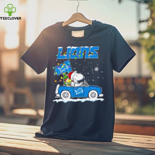 Happy Merry Christmas Snoopy drive a car Detroit Lions logo flag gift hoodie, sweater, longsleeve, shirt v-neck, t-shirt