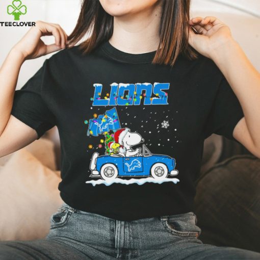 Happy Merry Christmas Snoopy drive a car Detroit Lions logo flag gift hoodie, sweater, longsleeve, shirt v-neck, t-shirt